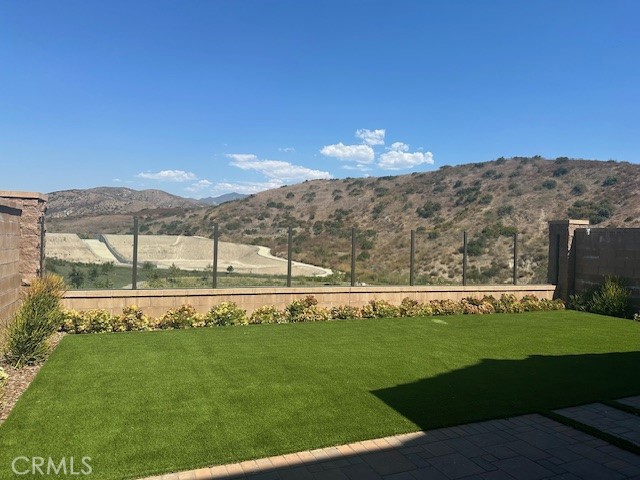 a view of a swimming pool with a yard