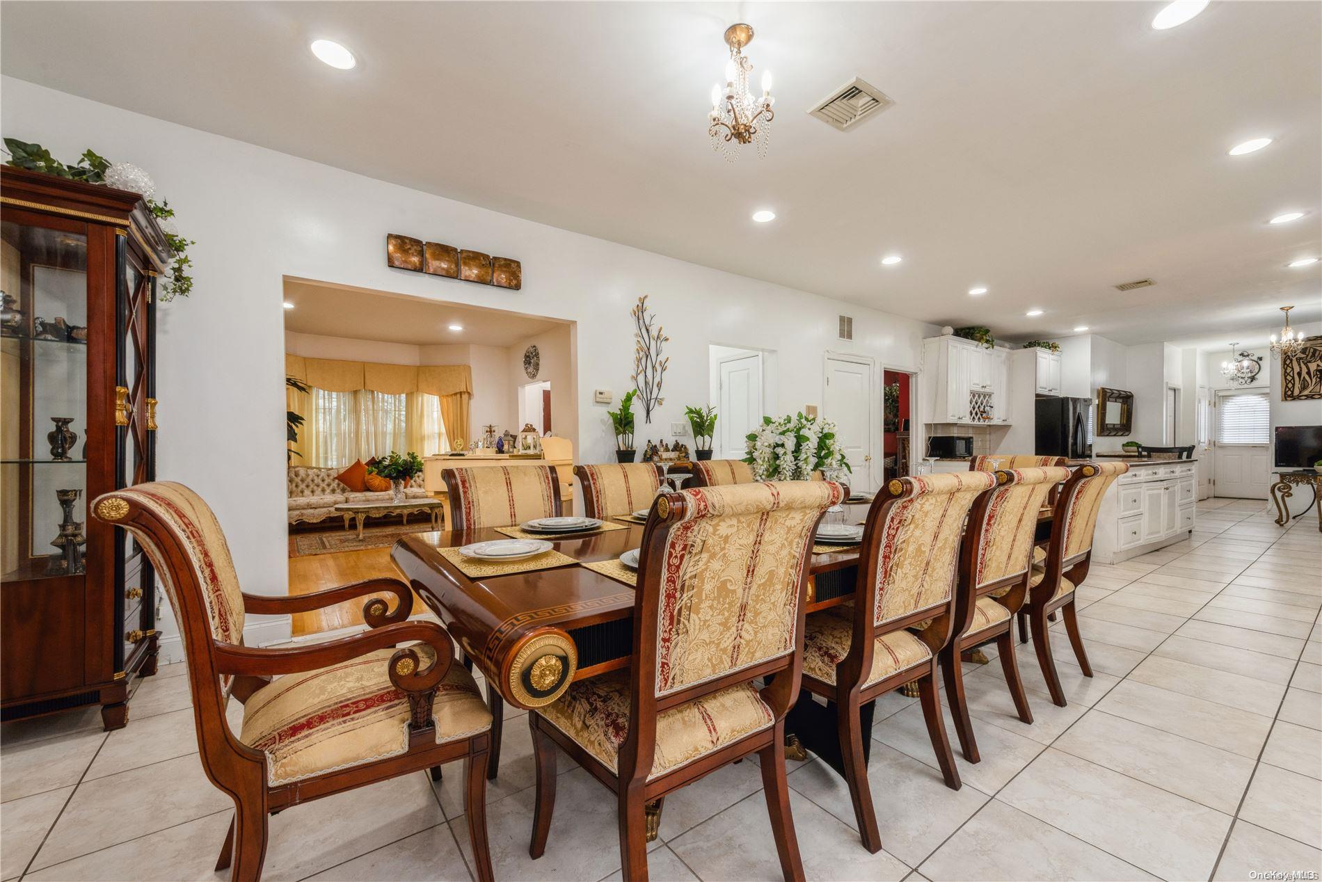 968 Bowe Road Valley Stream, NY 11580 - Photo 13 of 36 a dining room with furniture and a view of a room