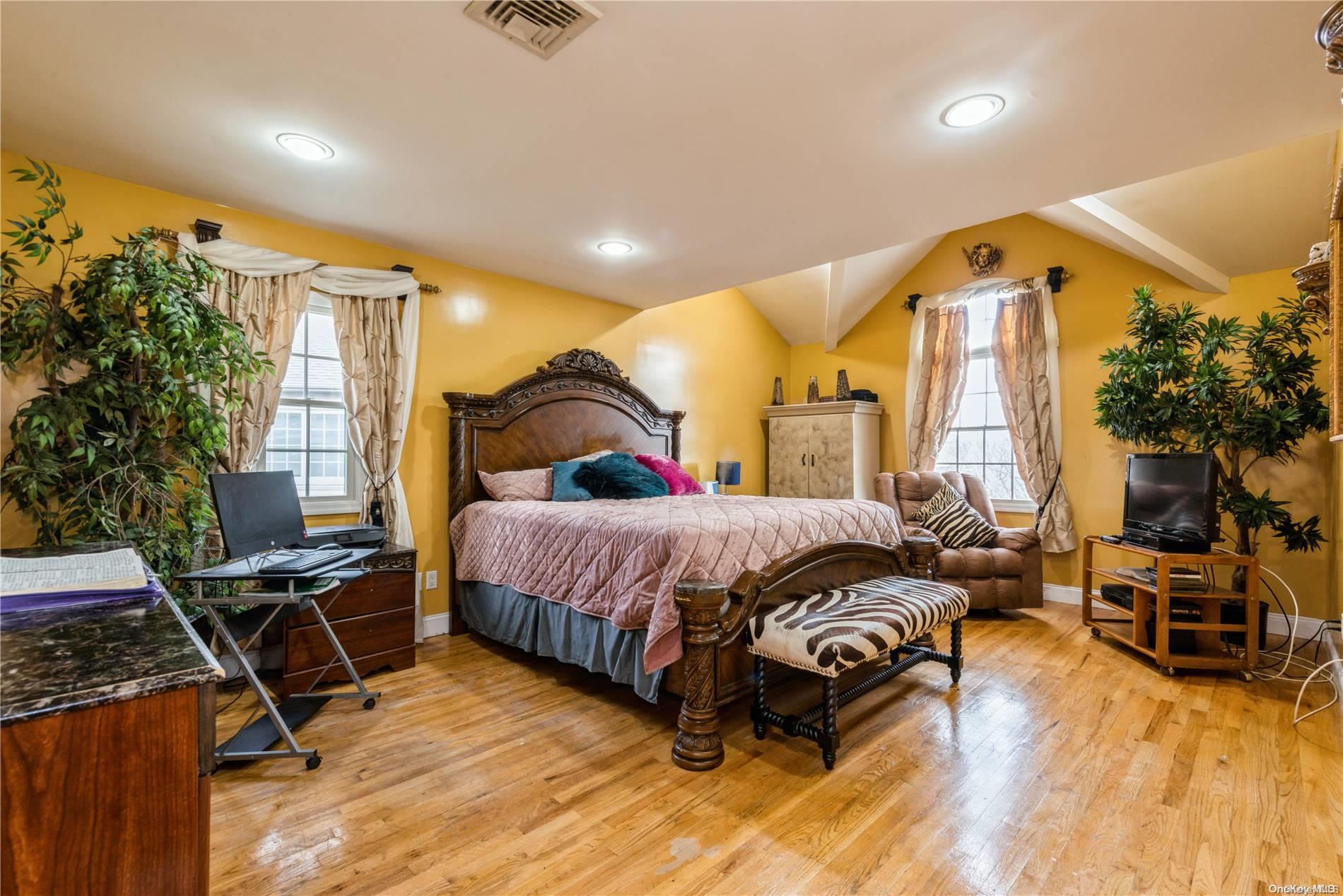 968 Bowe Road Valley Stream, NY 11580 - Photo 23 of 36 a bedroom with a bed and wooden floor