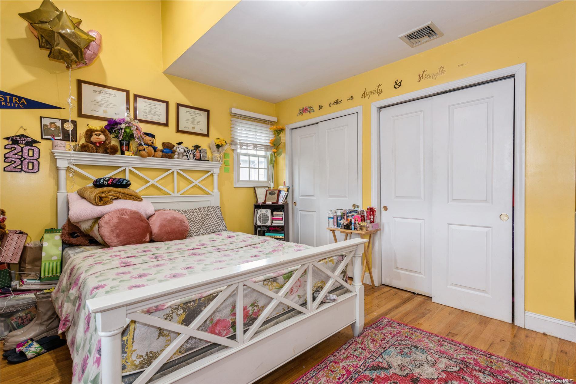 968 Bowe Road Valley Stream, NY 11580 - Photo 28 of 36 a bedroom with bed and wooden floor