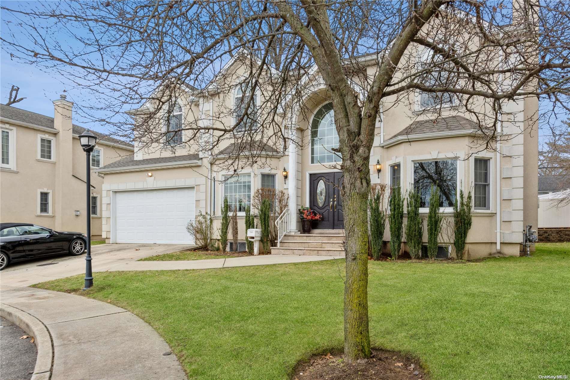 968 Bowe Road Valley Stream, NY 11580 - Photo 3 of 36 a front view of a house with a yard