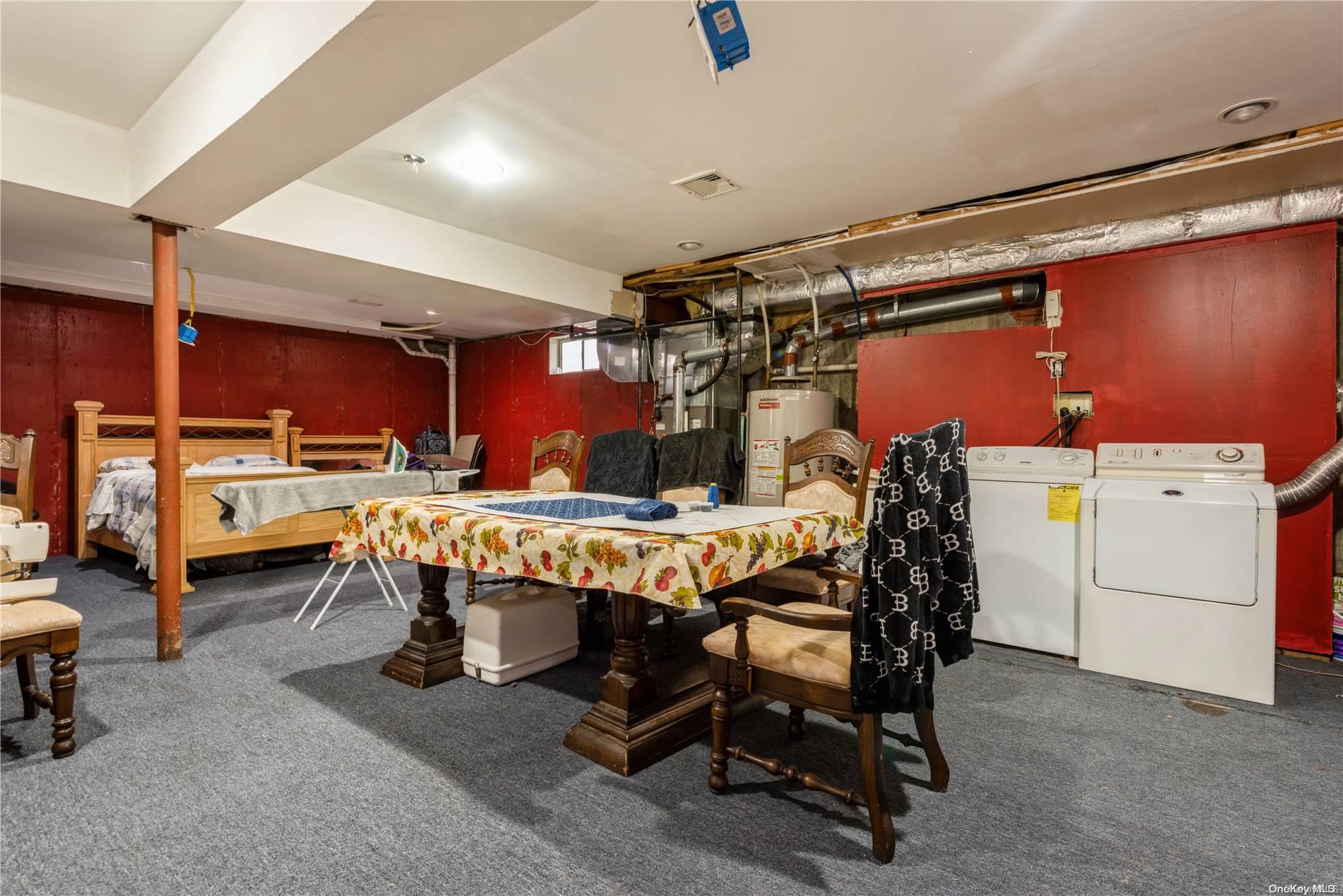968 Bowe Road Valley Stream, NY 11580 - Photo 32 of 36 a view of a room with furniture and a chandelier