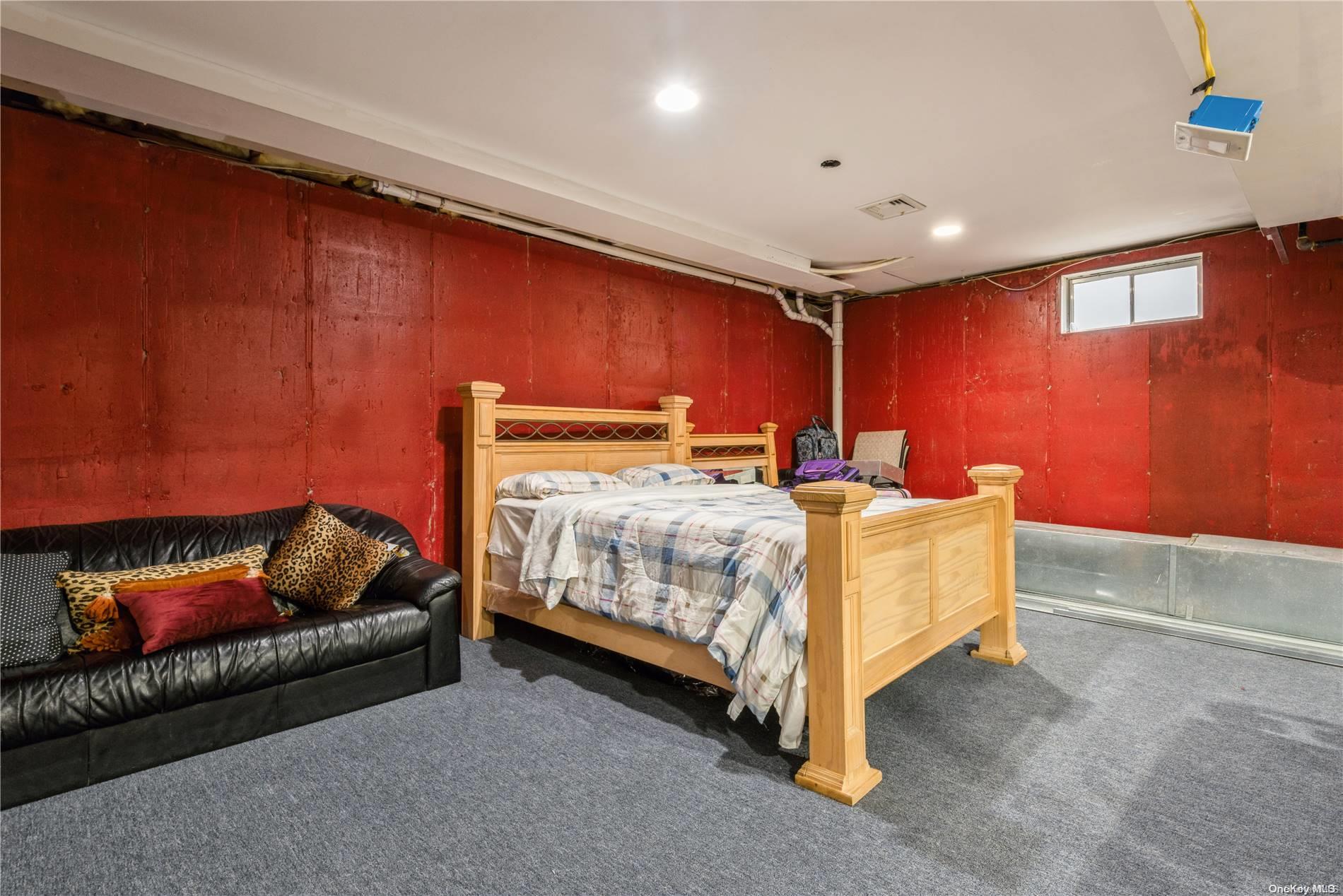 968 Bowe Road Valley Stream, NY 11580 - Photo 33 of 36 a bed room with a bed and a couch