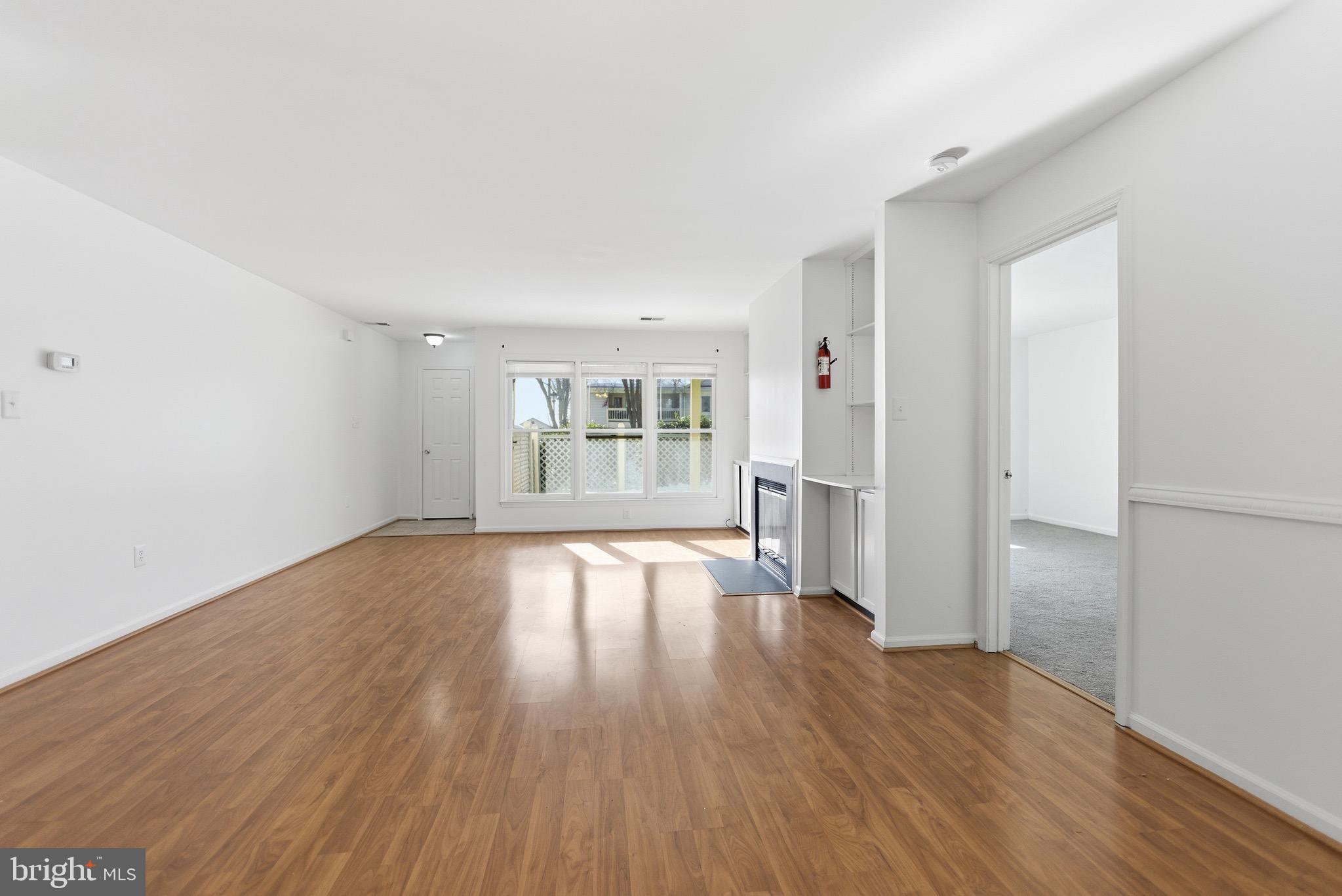 20565 Shadyside Way Germantown, MD 20874 - Photo 4 of 17 wooden floor in an empty room with a window