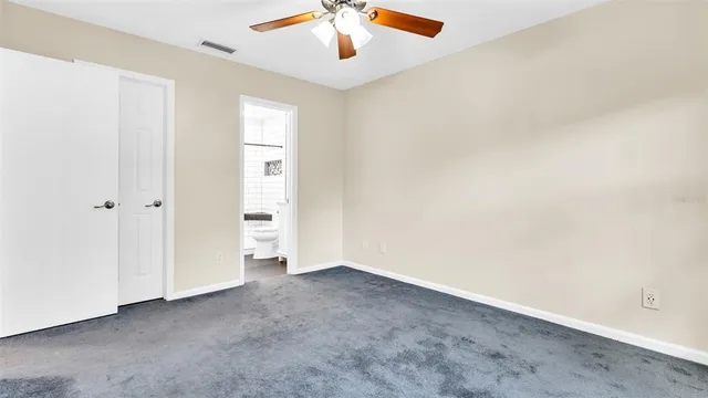 a view of a backyard with wooden fence