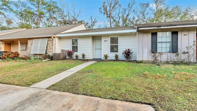 a kitchen with stainless steel appliances granite countertop a sink and a microwave