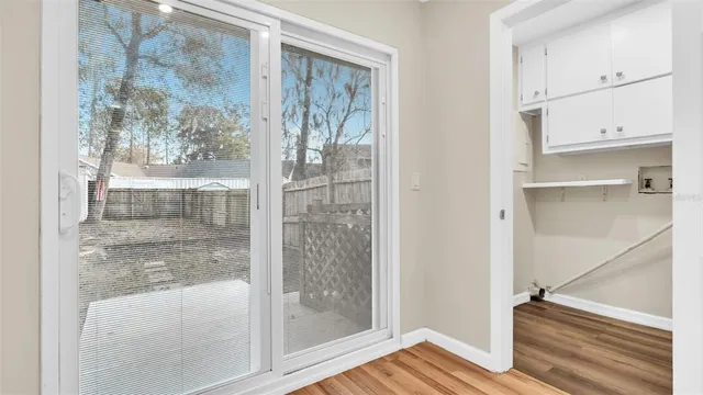 a view of a house with a backyard and a patio