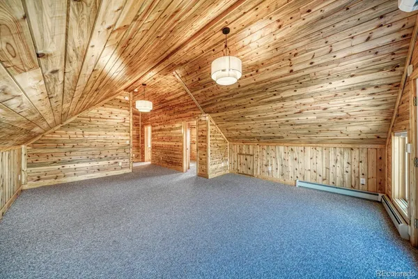 a view of a room with wooden walls