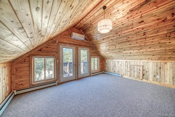 a view of an empty room with windows