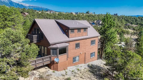 a aerial view of a house with a yard