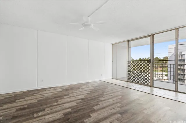 a view of a room with wooden floor