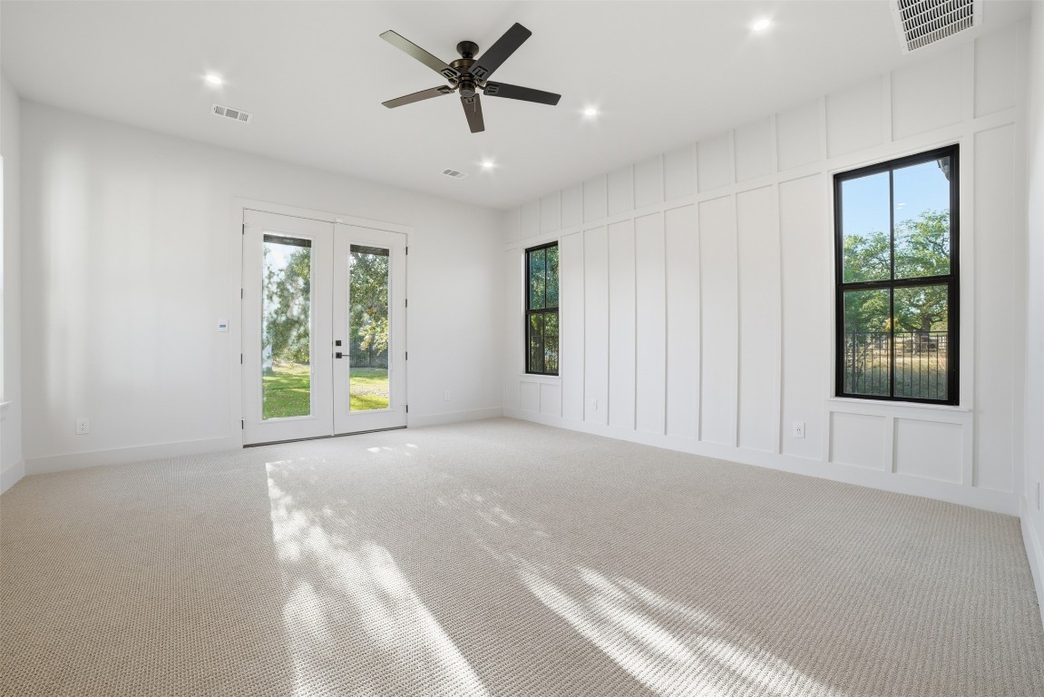 23937 Oscar Road Spicewood, TX 78669 - Photo 13 of 36 a view of an empty room with a window