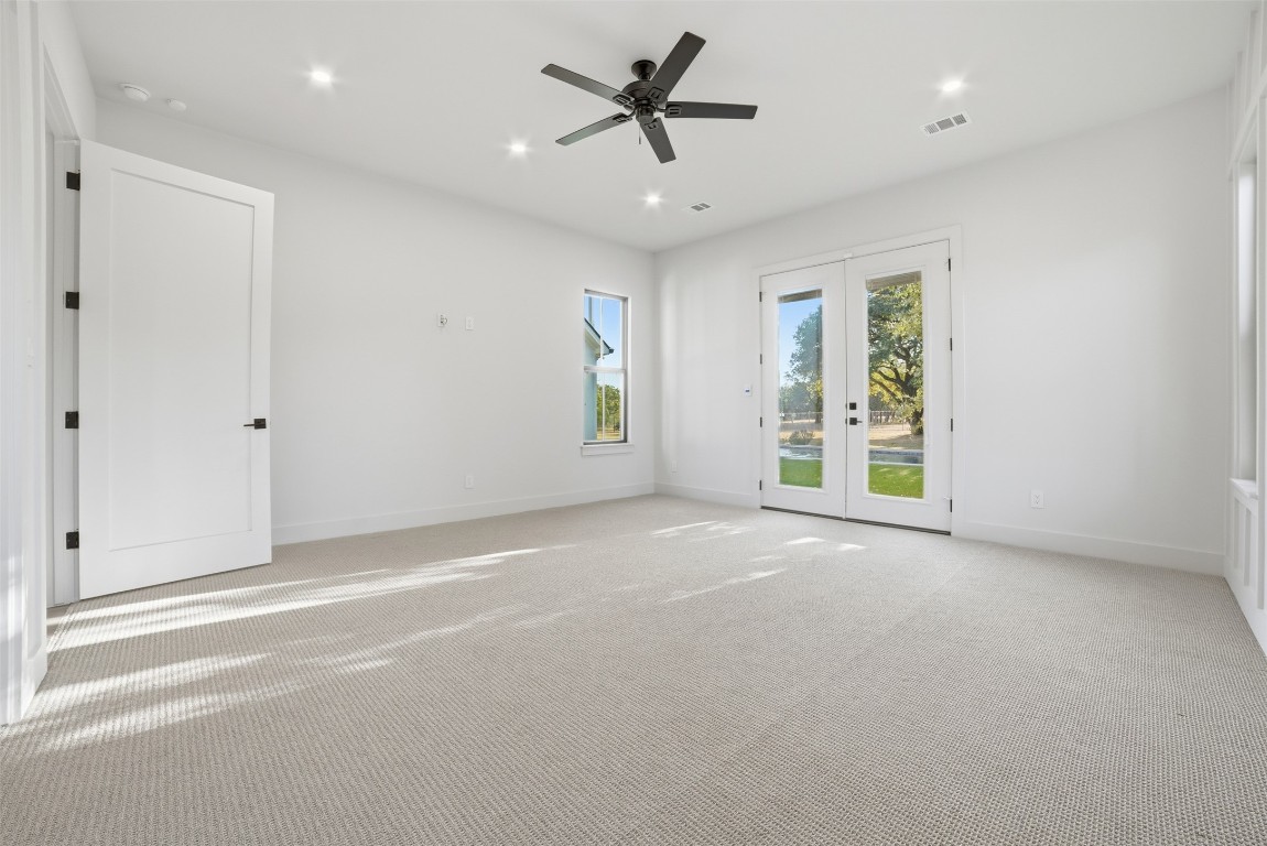 23937 Oscar Road Spicewood, TX 78669 - Photo 14 of 36 a view of a livingroom with a ceiling fan and window