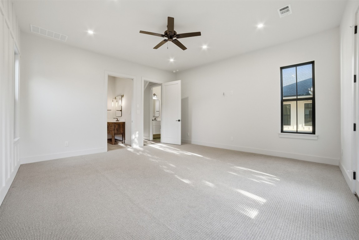 23937 Oscar Road Spicewood, TX 78669 - Photo 22 of 36 a view of a livingroom with a ceiling fan and window