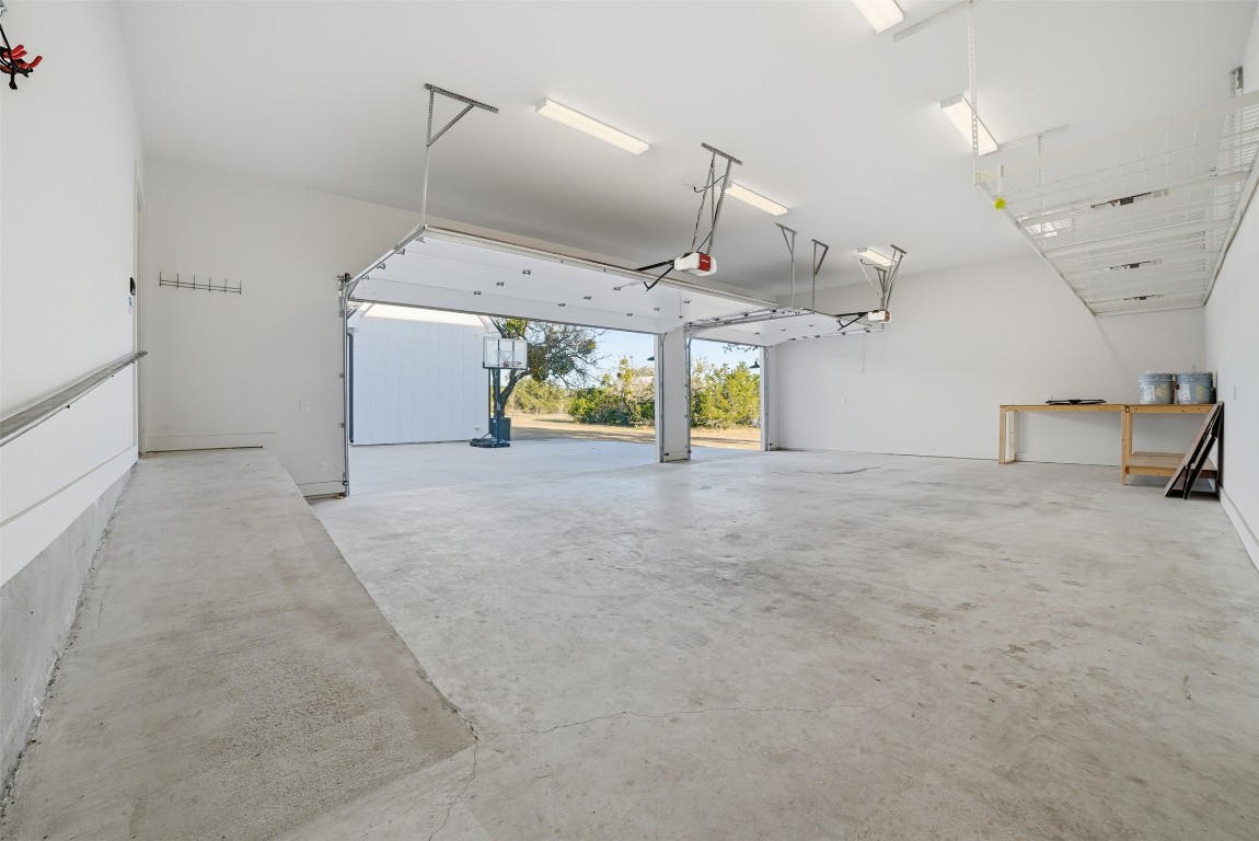 23937 Oscar Road Spicewood, TX 78669 - Photo 28 of 36 an empty room with projector and washer