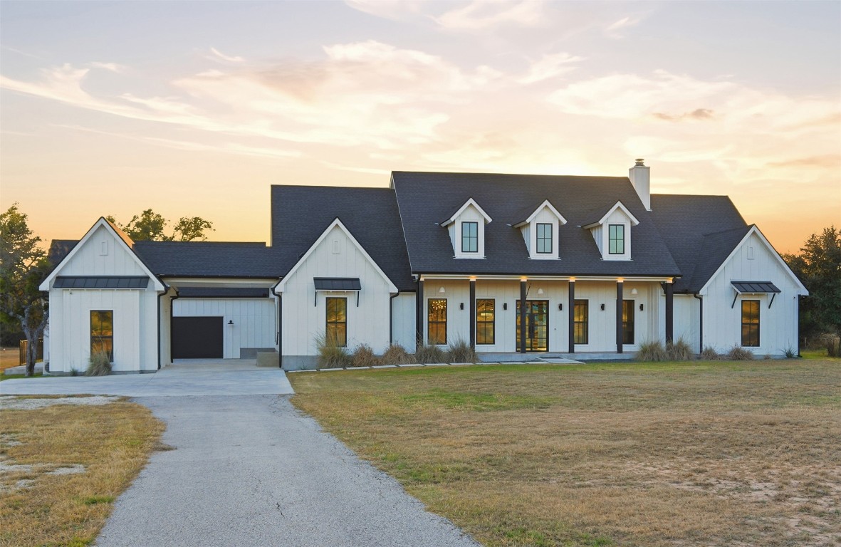 23937 Oscar Road Spicewood, TX 78669 - Photo 36 of 36 front view of a house with a yard