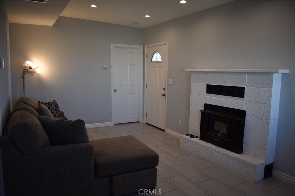 20511 Memory Apple Valley, CA 92308 - Photo 11 of 23 a living room with furniture and a fireplace