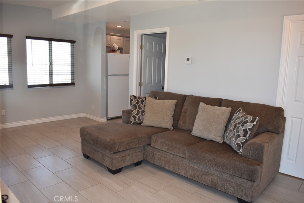 20511 Memory Apple Valley, CA 92308 - Photo 13 of 23 a living room with a couch and a window
