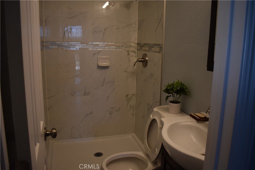 20511 Memory Apple Valley, CA 92308 - Photo 19 of 23 a bathroom with a sink a toilet and shower