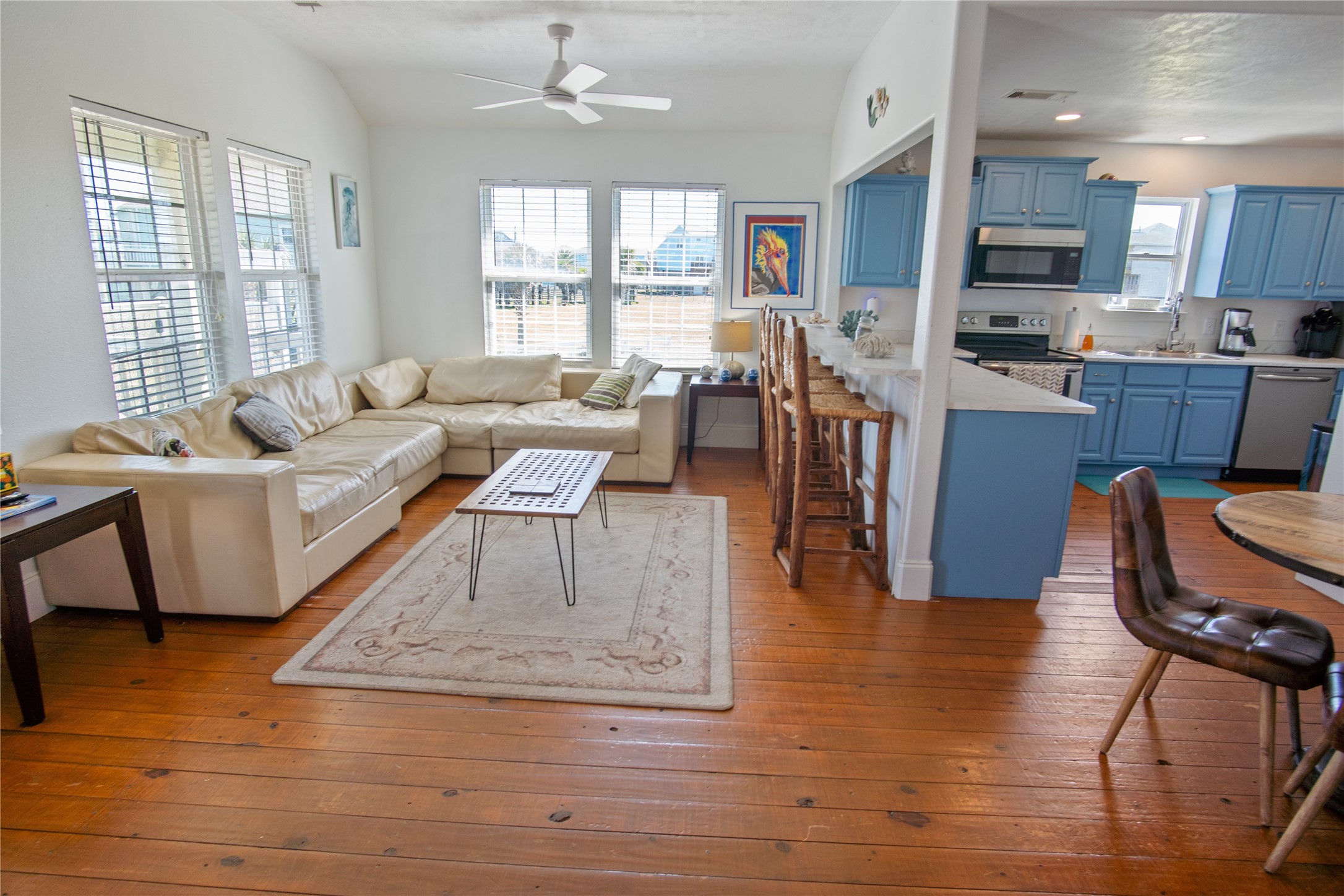 2371 Sandman Crystal Beach, TX 77650 - Photo 15 of 38 a living room with fireplace furniture and a wooden floor