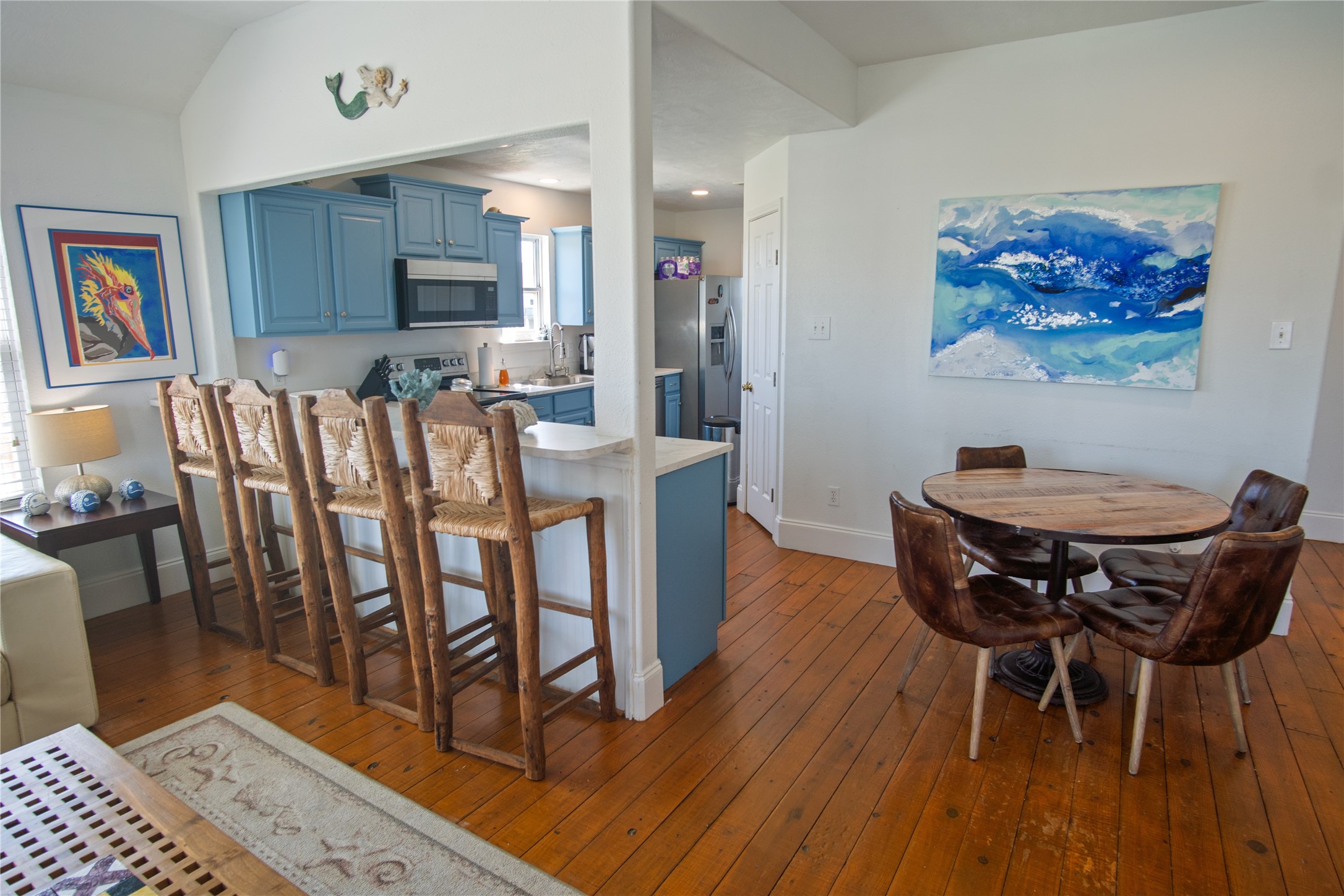 2371 Sandman Crystal Beach, TX 77650 - Photo 16 of 38 a view of a dining room with furniture and wooden floor