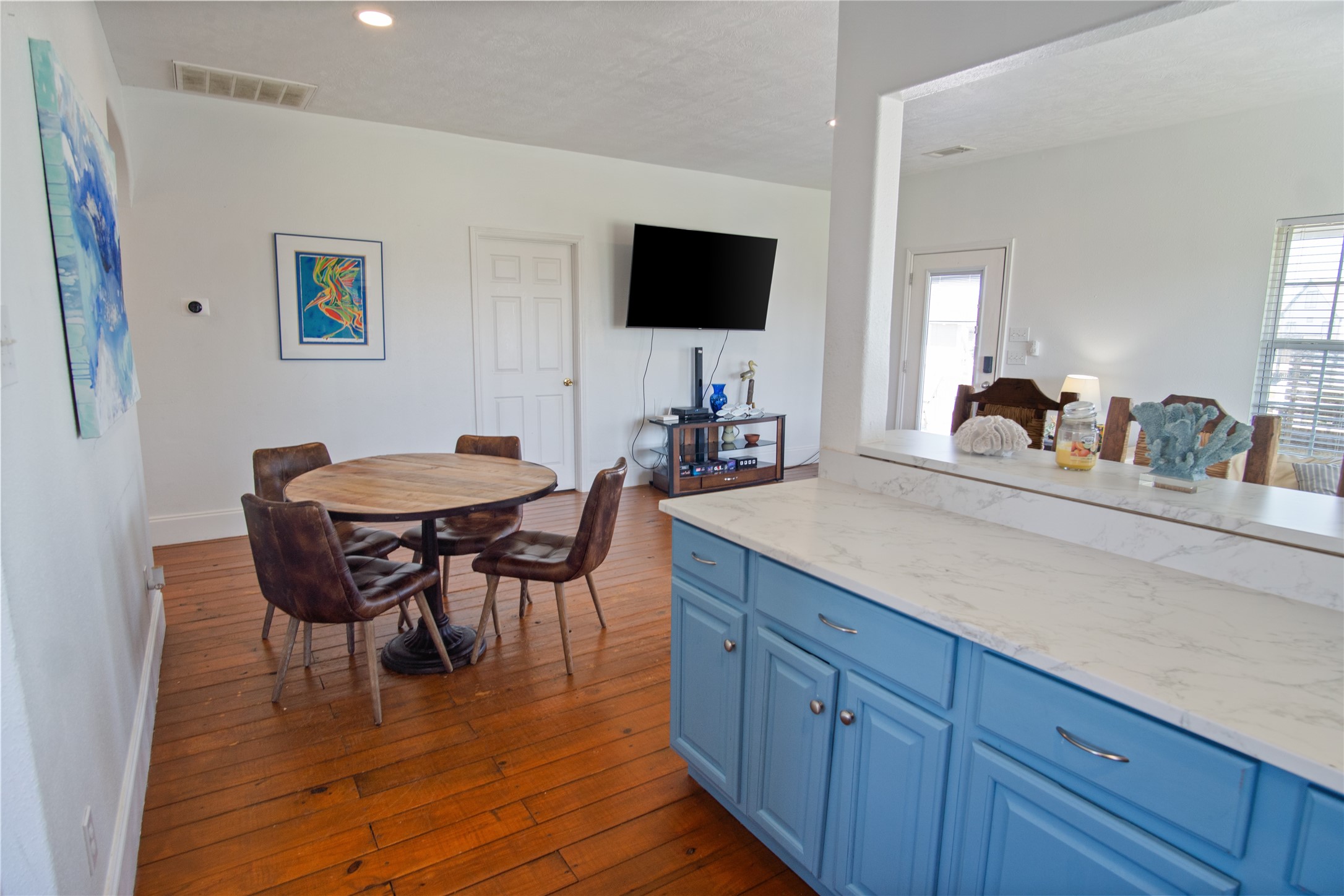 2371 Sandman Crystal Beach, TX 77650 - Photo 19 of 38 a view of a dining room with furniture and wooden floor