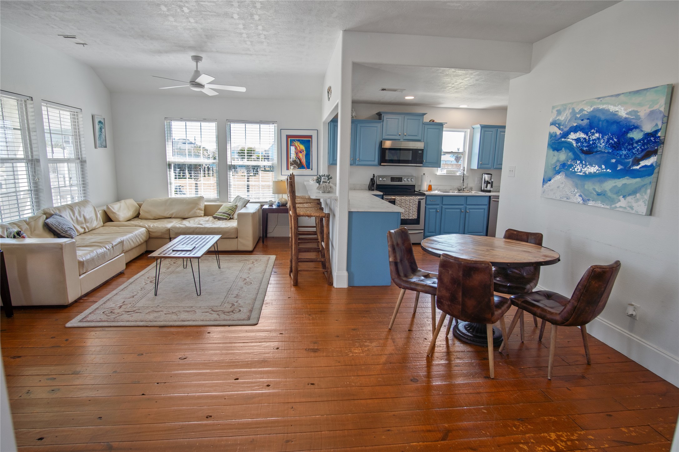 2371 Sandman Crystal Beach, TX 77650 - Photo 22 of 38 a living room with fireplace furniture and a wooden floor