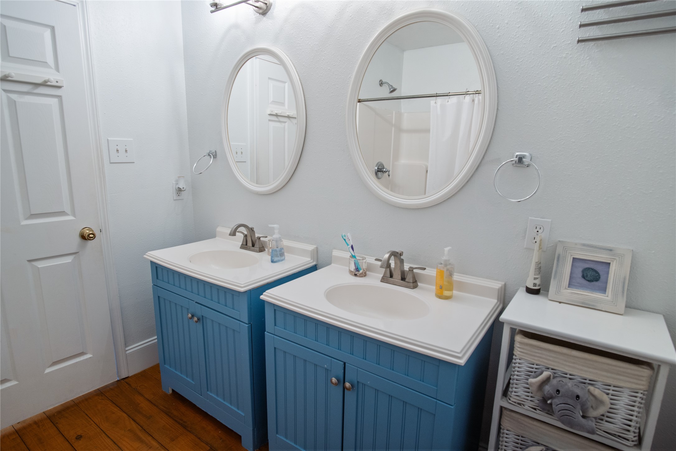 2371 Sandman Crystal Beach, TX 77650 - Photo 27 of 38 a bathroom with 2 sink and a mirror