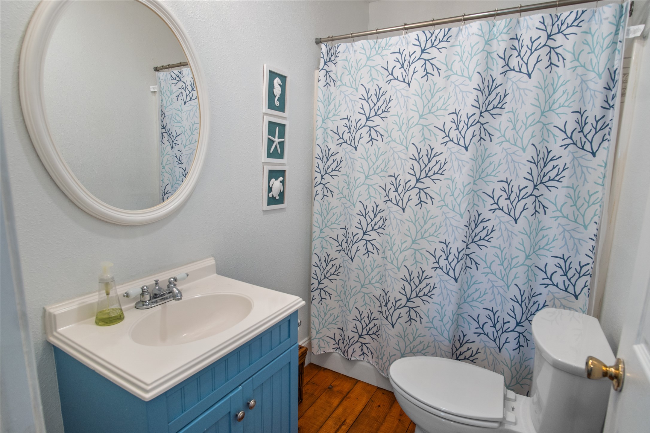2371 Sandman Crystal Beach, TX 77650 - Photo 30 of 38 a bathroom with a toilet sink and mirror