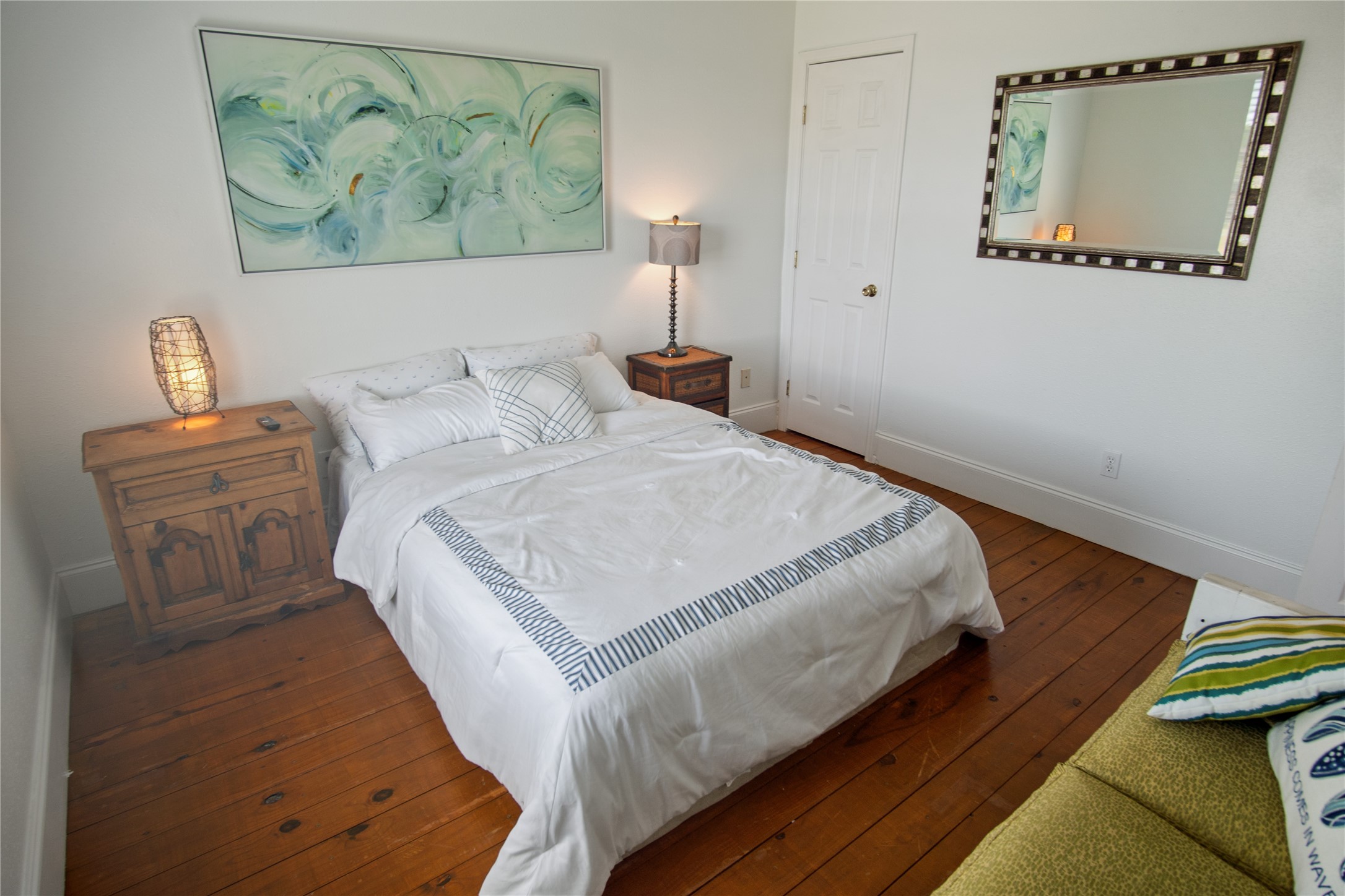 2371 Sandman Crystal Beach, TX 77650 - Photo 33 of 38 a bedroom with a bed and a painting on the wall