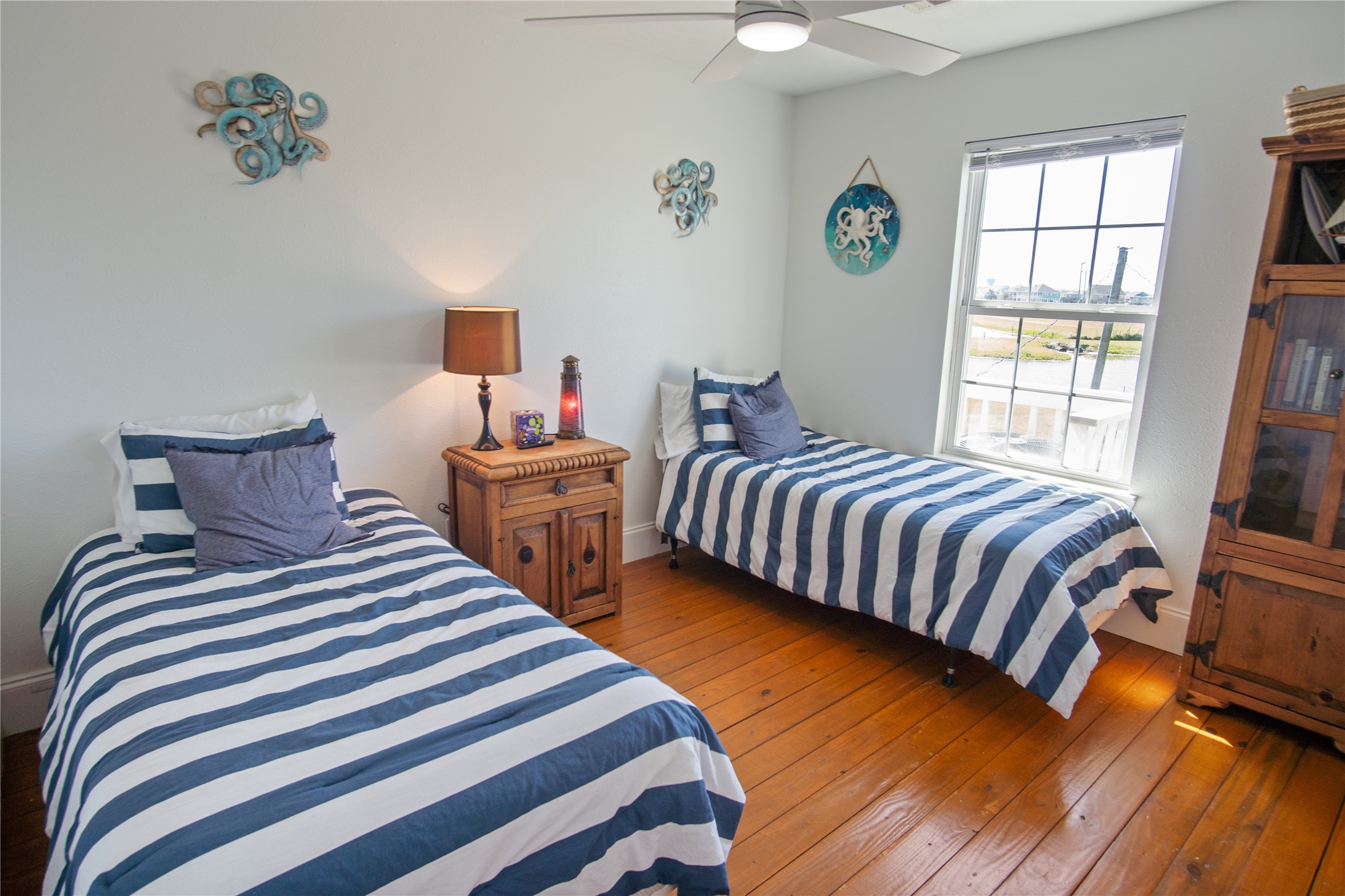 2371 Sandman Crystal Beach, TX 77650 - Photo 34 of 38 a bedroom with two beds and a window