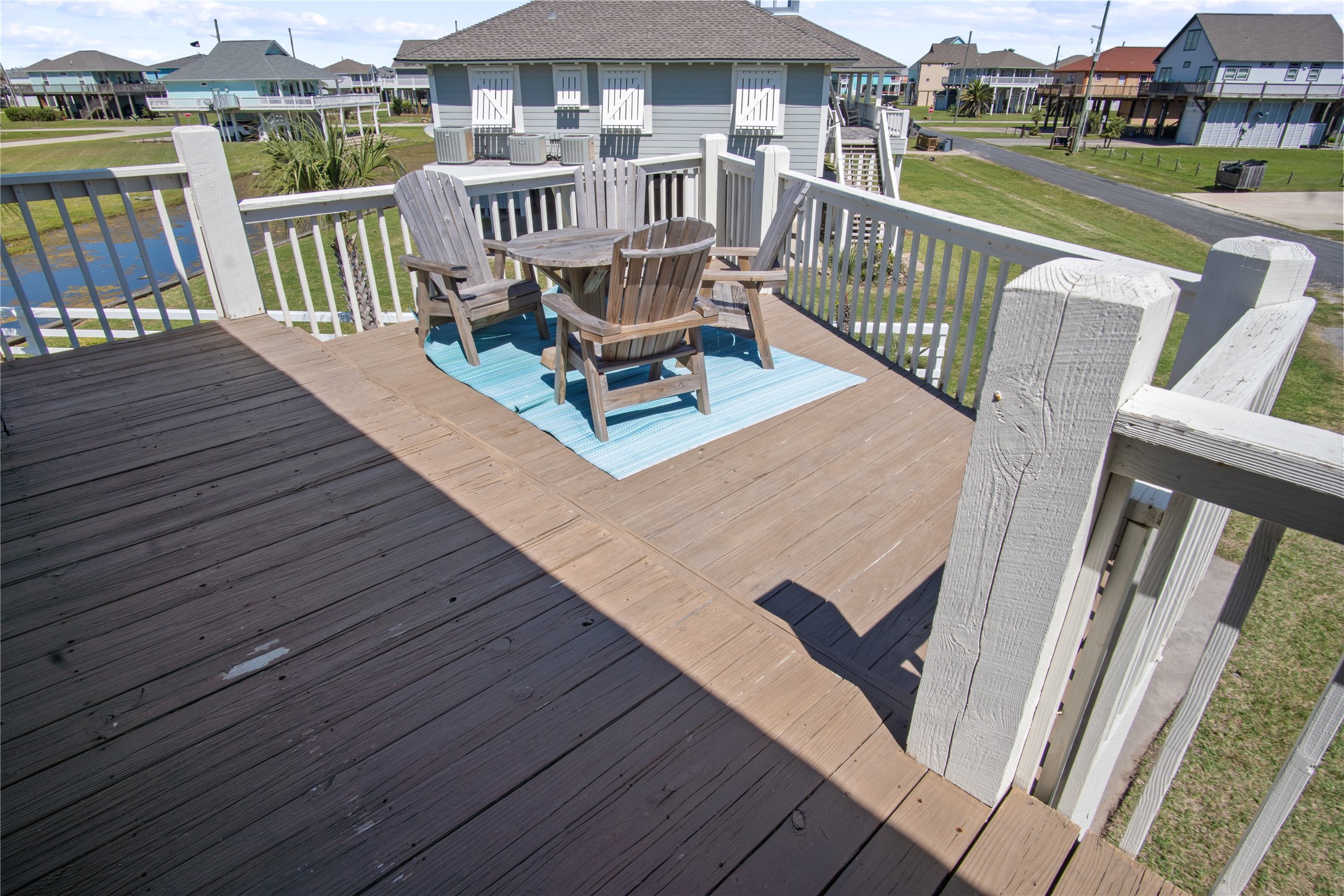 2371 Sandman Crystal Beach, TX 77650 - Photo 8 of 38 a view of a deck with two chair and wooden floor