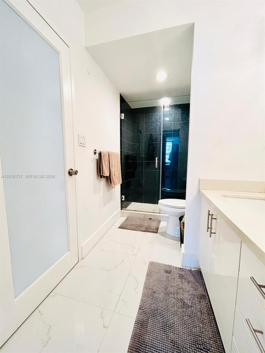 100 Lincoln Road, Unit 1526 Miami Beach, FL 33139 - Photo 6 of 9 a bathroom with a tub and shower
