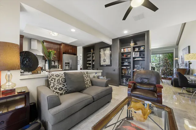 a living room with furniture or couch and a flat screen tv