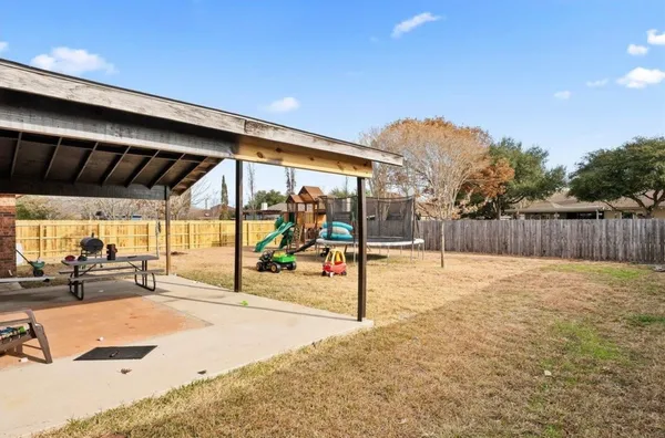 a view of a backyard of a house