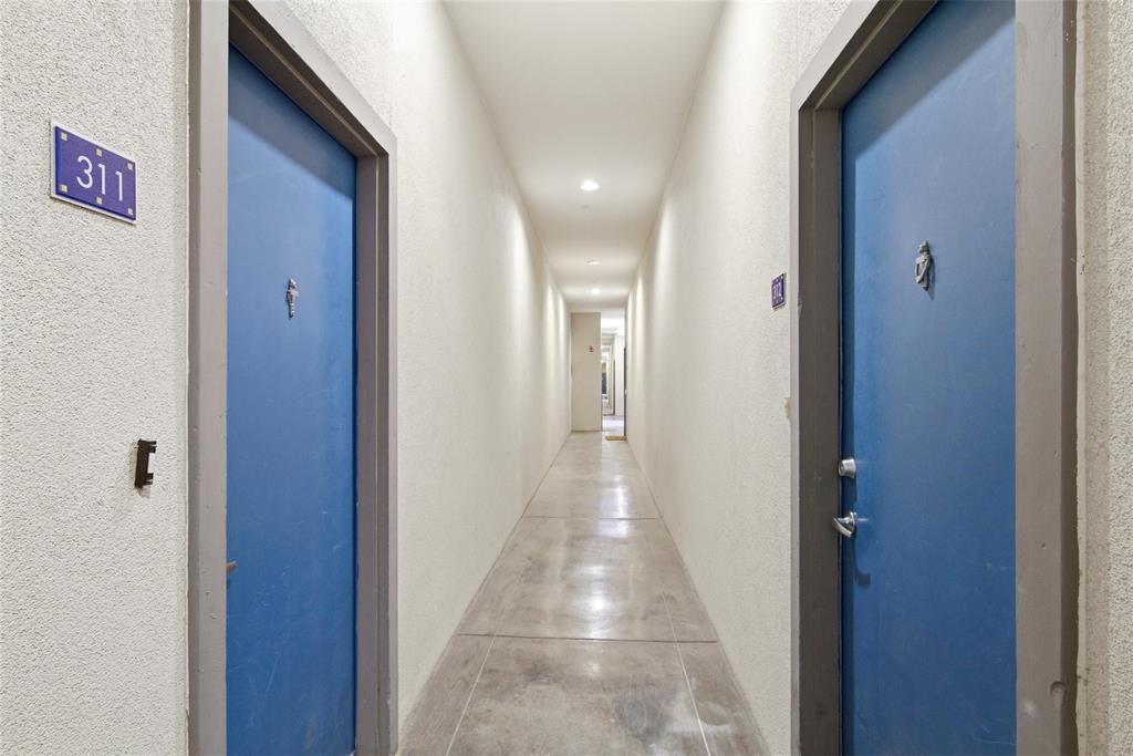 4414 Cedar Springs Road, Unit 312 Dallas, TX 75219 - Photo 11 of 30 a view of a hallway with wooden floor