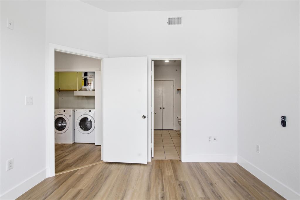 4414 Cedar Springs Road, Unit 312 Dallas, TX 75219 - Photo 16 of 30 a view of a storage & utility room with wooden floor