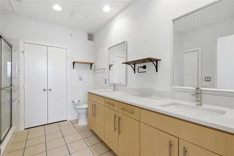 an empty room with sliding glass door and mountain view