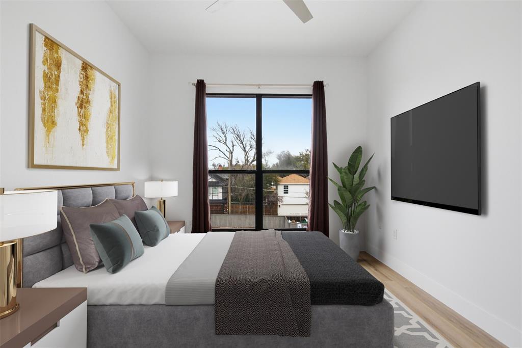 4414 Cedar Springs Road, Unit 312 Dallas, TX 75219 - Photo 5 of 30 a bedroom with a bed tv and window