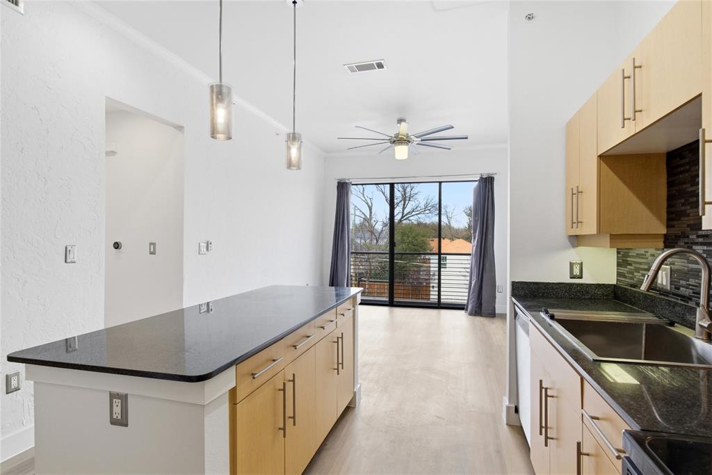 4414 Cedar Springs Road, Unit 312 Dallas, TX 75219 - Photo 9 of 30 a kitchen with a sink stove and microwave