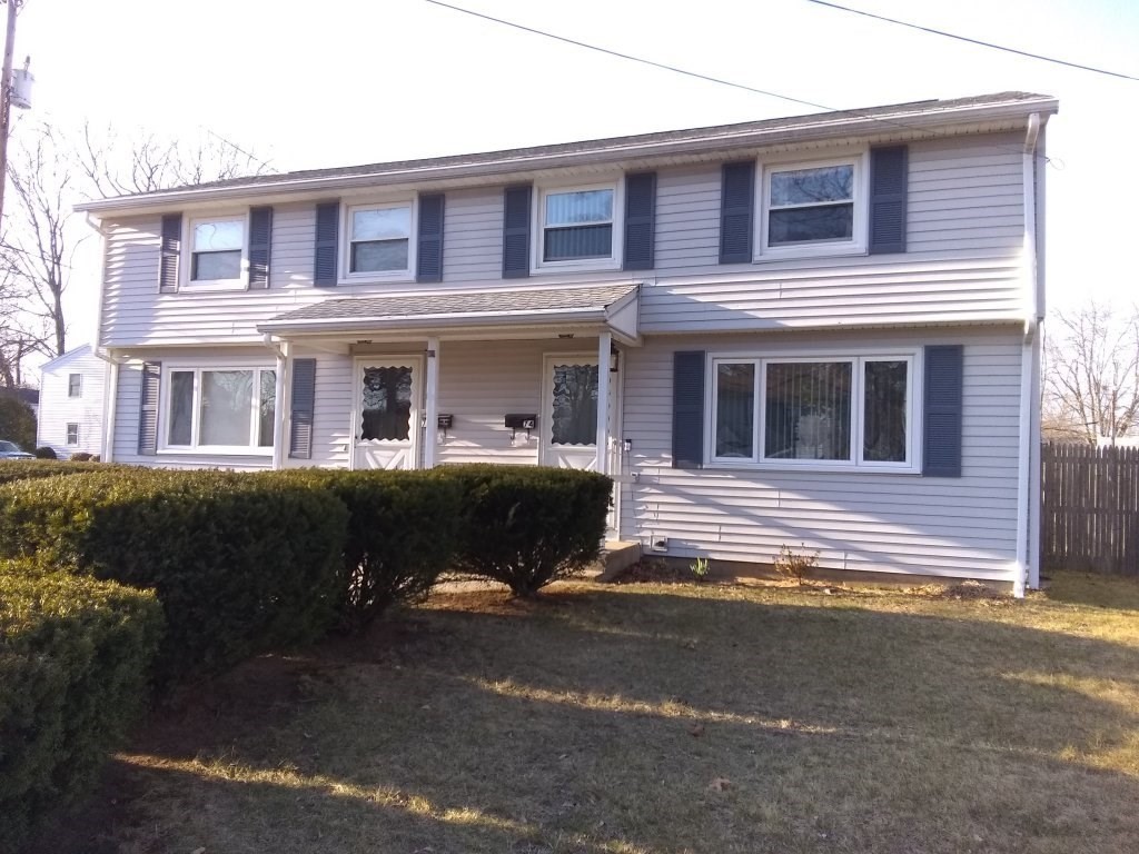 72-74 Tulsa Street Springfield, MA 01118 - Photo 1 of 16 a front view of a house with a yard