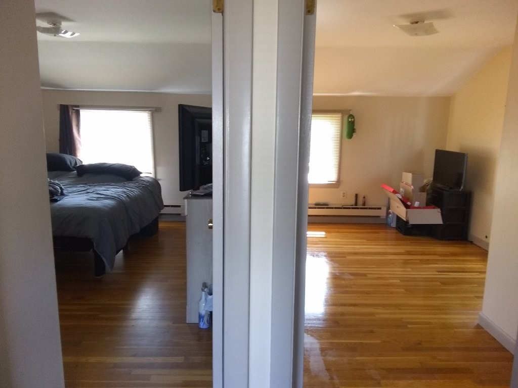 72-74 Tulsa Street Springfield, MA 01118 - Photo 5 of 16 a living room with furniture and a wooden floor