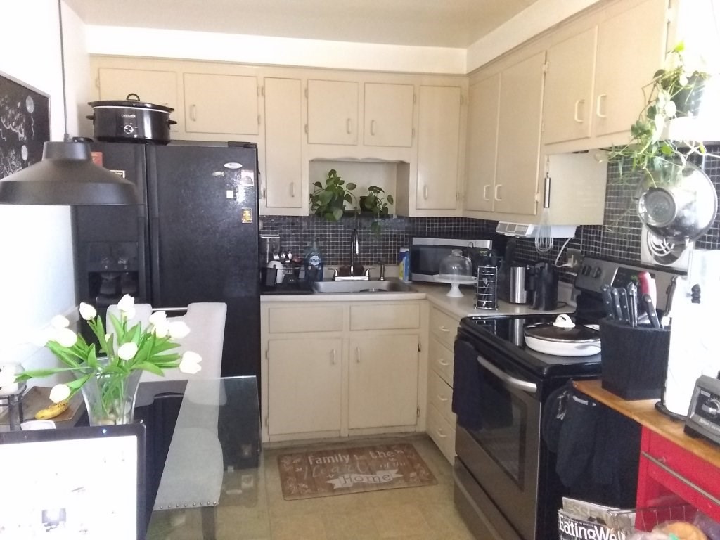 72-74 Tulsa Street Springfield, MA 01118 - Photo 7 of 16 a kitchen with a sink refrigerator and cabinets