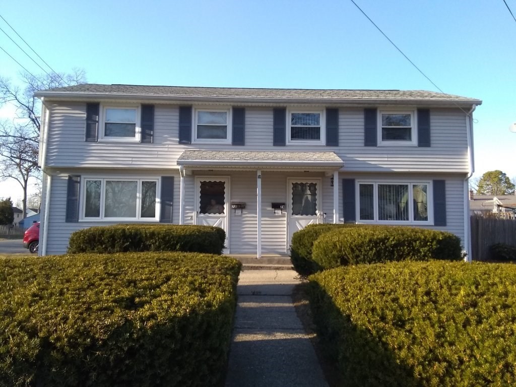72-74 Tulsa Street Springfield, MA 01118 - Photo 10 of 16 a front view of a house with a yard