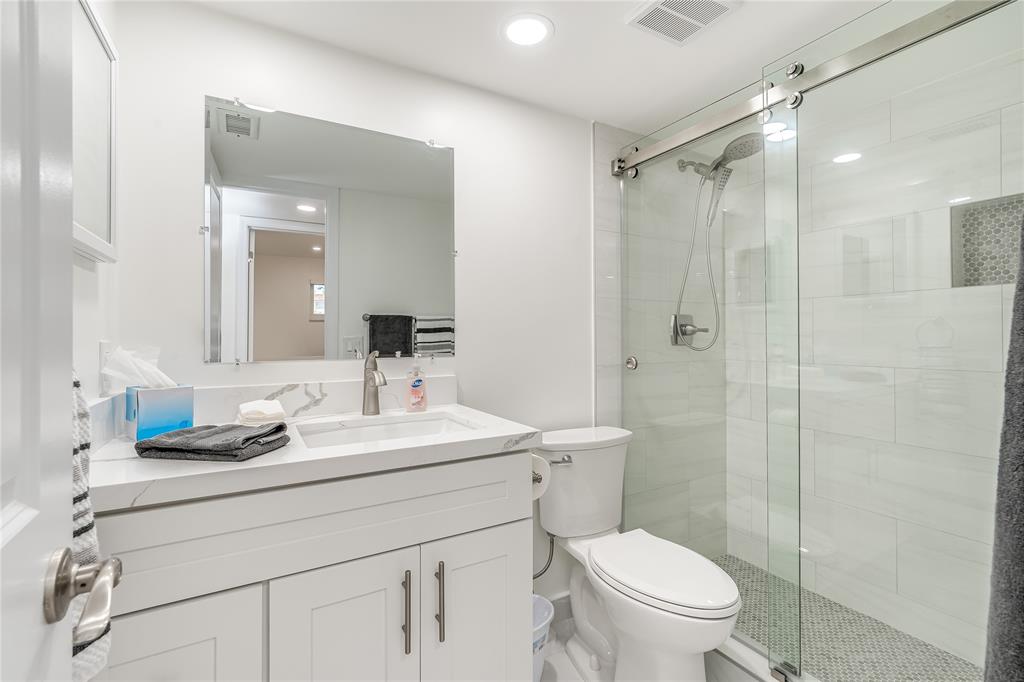 411 South Hollybrook Drive, Unit 109 Pembroke Pines, FL 33025 - Photo 15 of 61 a bathroom with a sink a toilet a mirror and shower