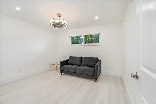 a view of storage and utility room with two washing machine