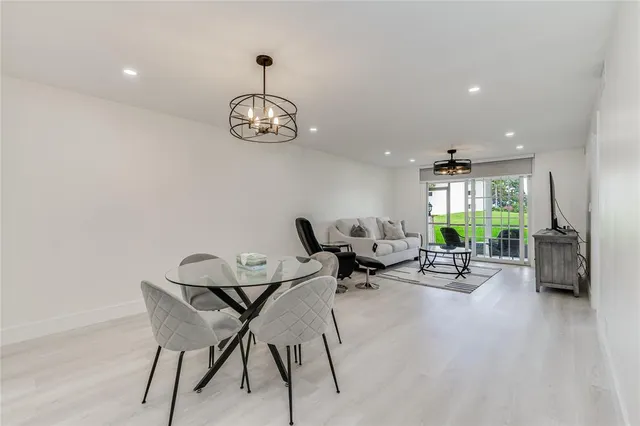 a view of a hallway with furniture and entryway