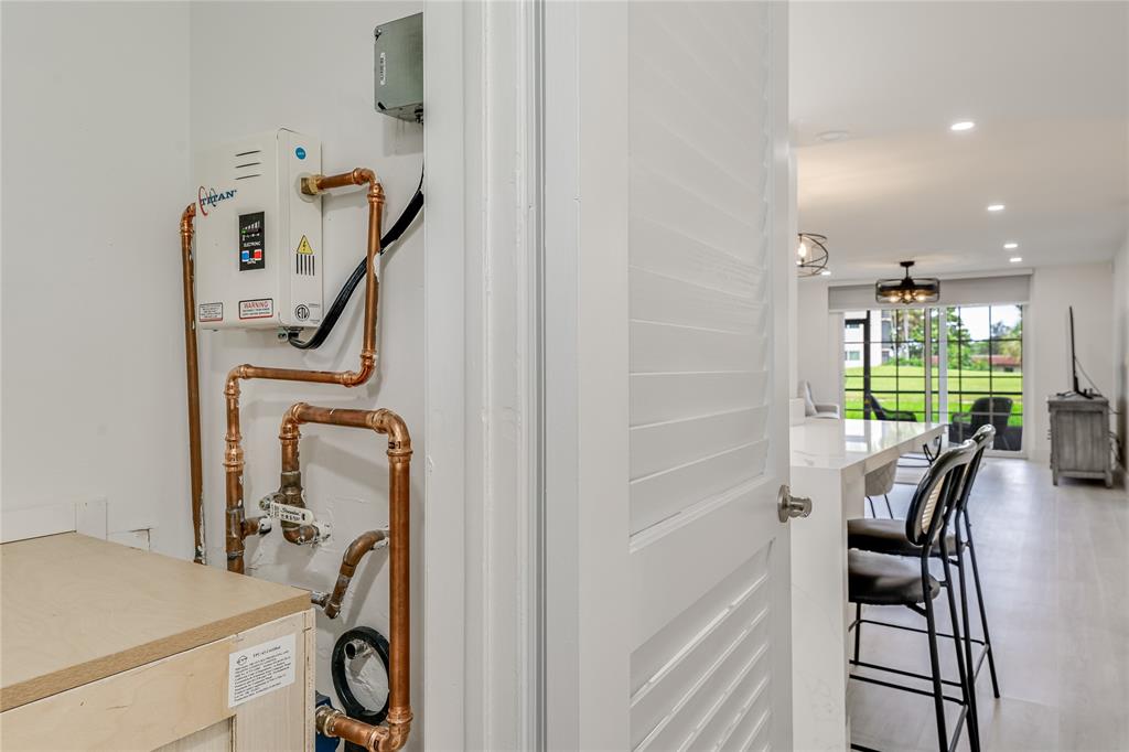 411 South Hollybrook Drive, Unit 109 Pembroke Pines, FL 33025 - Photo 19 of 61 a view of a hallway with furniture and entryway