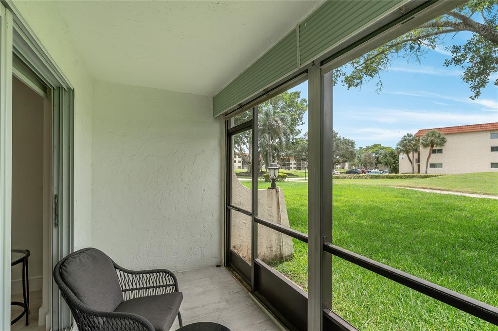 411 South Hollybrook Drive, Unit 109 Pembroke Pines, FL 33025 - Photo 22 of 61 a view of a two chair in the balcony