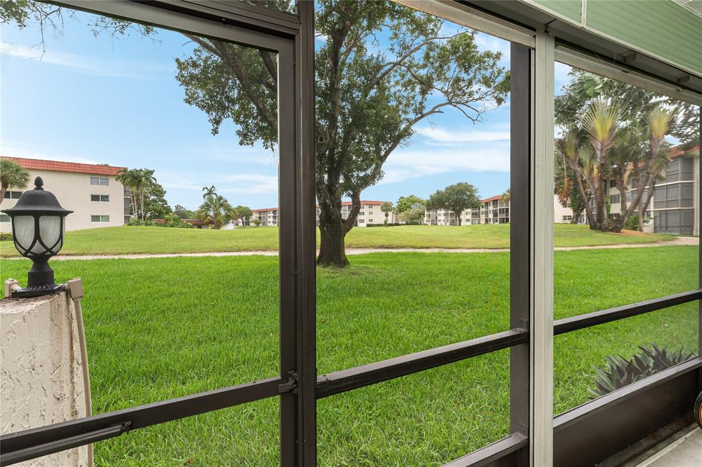 411 South Hollybrook Drive, Unit 109 Pembroke Pines, FL 33025 - Photo 23 of 61 a view of a yard with a large tree